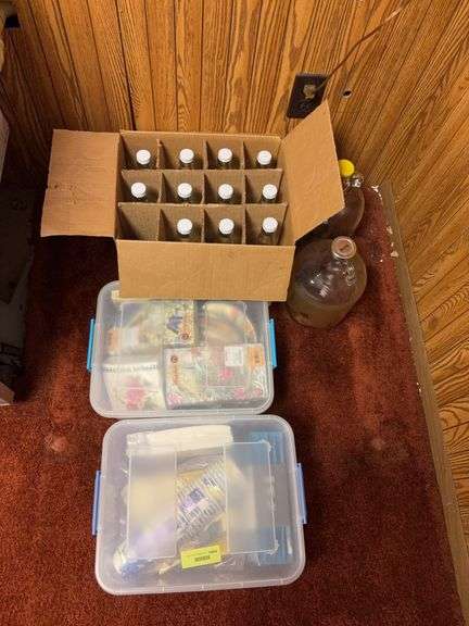 Paper plates and wine bottles plus (2) 1 gallon jugs image