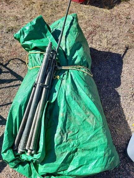 Tent green tarp GP small 16' stakes and ropes; octagon, has a liner included