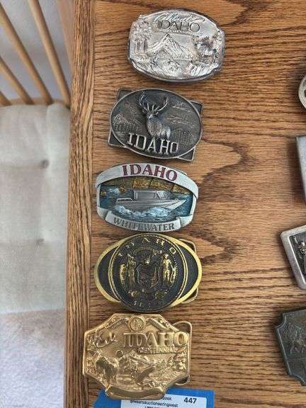 Five Idaho belt buckles