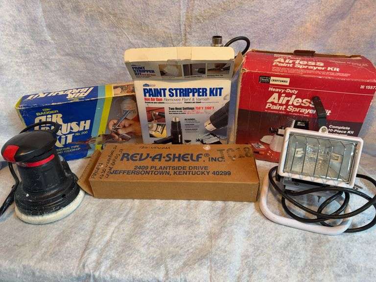 One lot Craftsman airless paint sprayer kit,  clean condition. Badger airbrush kit appears unused. Vapor 6-in random orbital buffer polisher. Home Right paint stripper hot air gun. Work light. Rev-a-shelf. image