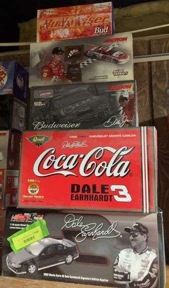 Three1:24 scale, one 1:18 and one 1:32 die cast cars as shown image