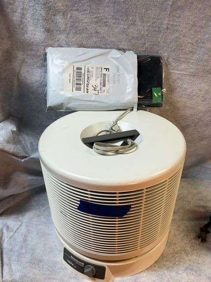 Black& Decker benchtop Workman, Craftsman jigsaw, Toolshop circular saw, Honeywell envirocare HEPA air cleaner with extra filter, detail sander. image