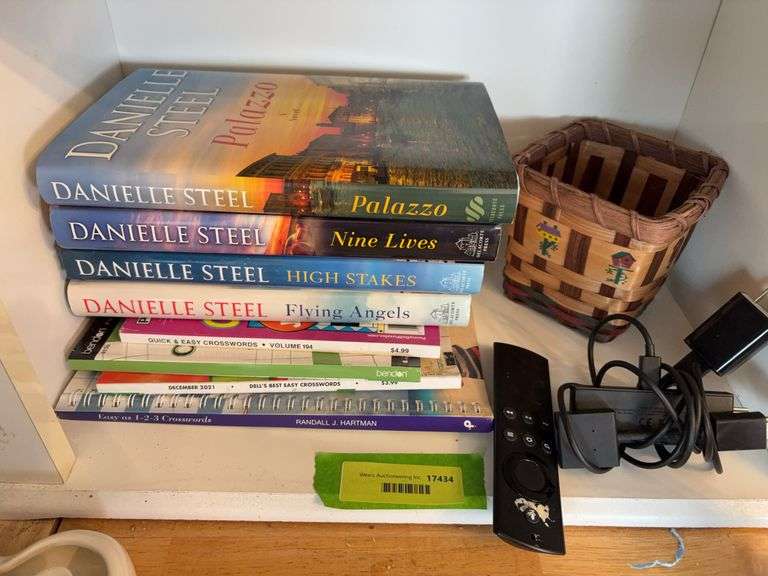 Danielle Steel books, crossword puzzle books and an Amazon Fire Stick image