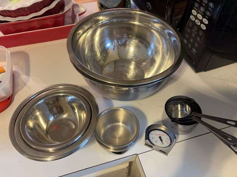 Stainless steel mixing bowls and dry measuring cups image