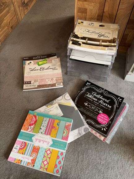 Scrap booking pads of paper and acrylic storage trays image