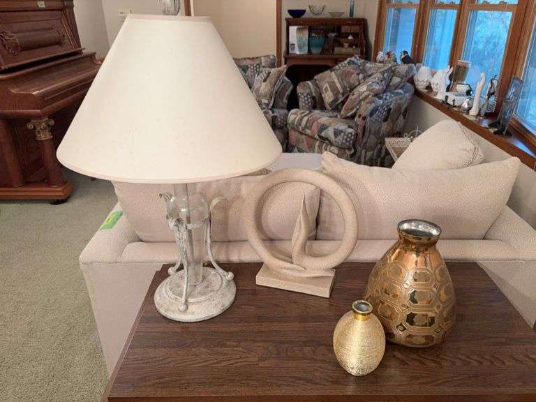 Two gold vases, a table lamp and Buddha hand sculpture image