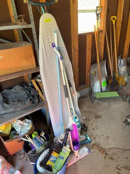 Ironing board, Swiffer mops and cleaning supplies and fluids image