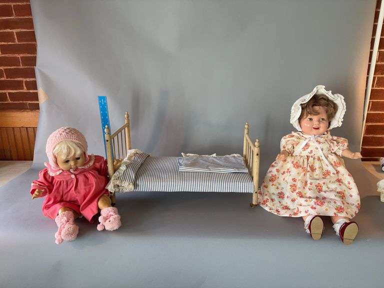 Doll bed and two dolls w sleep eyes and noise image