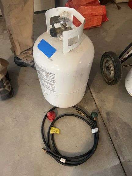 Oversized propane tank with hoses - full