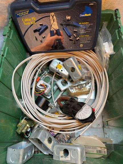 Electrical lot with three recessed down lights a 4-in cans with electric boxes, three white 4-in eyeball covers, one 5-in recessed downlight can, one tote of electrical miscellaneous stuff, approximately 50 ft of 14/2 with ground, metal boxes, EMT hardware, Western clamp on ammeter. image