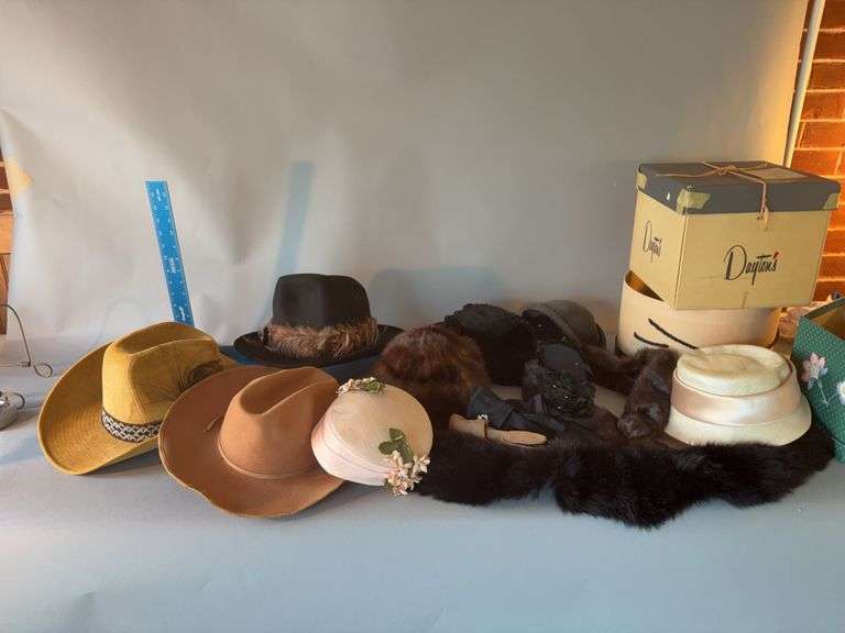 Three men’s cowboy hats, two fur hats and two stolls image