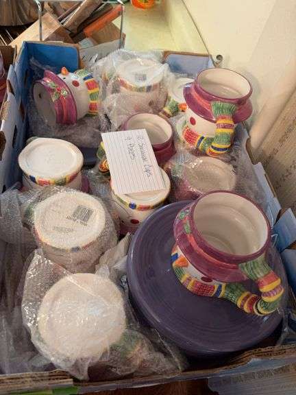 9 purple Gibson plates and 12 snowman mugs