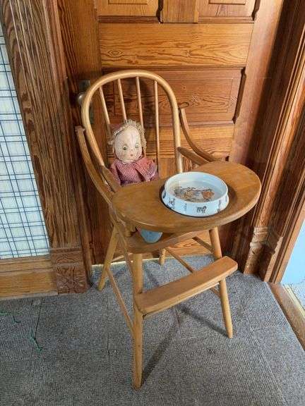 Wood high chair with baby bowl and baby image