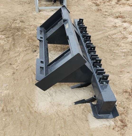 Skid Steer Ripper	WOLVERINE		RPR-12-72W	 Skid Steer Ripper Attachment  Width:72 in Overall Length:30 in Number of Teeth Standard:6 Number of Teeth Total Optional:11 Ripper Tooth Total Length:18.29 in Ripping Depth:7-9 in Weight:450 lbs, MOUNT VERNON image