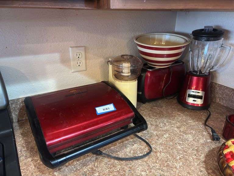 Red toaster, blender and George Foreman plus red plastic bowls and a chopper