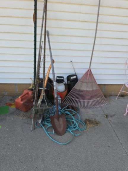 Yard tools, hand sprayer, bug zapper, horse shoes and more image