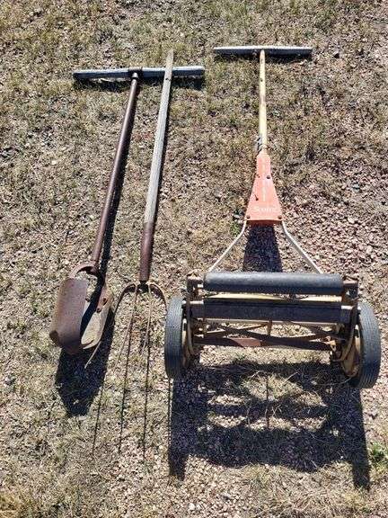 Mower, post hole digger,  fork image