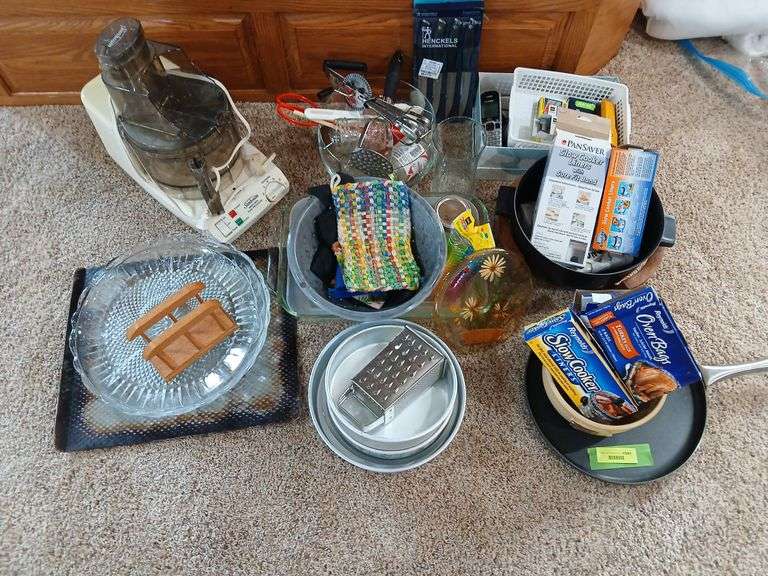 Kitchen items includes cooking liners, baking pans, Sunbeam food processor and more image