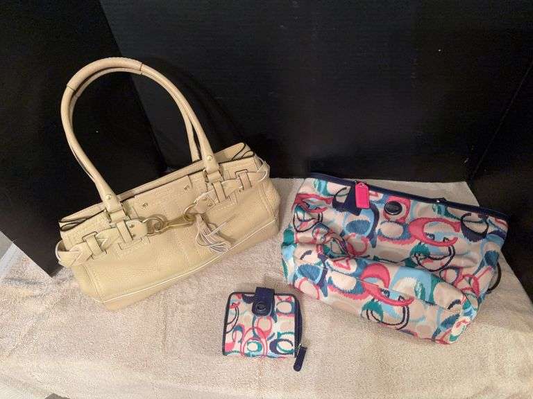 Two Coach purses, one with matching wallet image