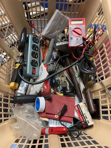 Box of tools including task force 4-1/2-in grinder, quarter inch drive metric sockets. Two digital volt meters. Two 25-ft cable snakes. Miscellaneous electric items, miscellaneous plumbing items, stapler and staples. image