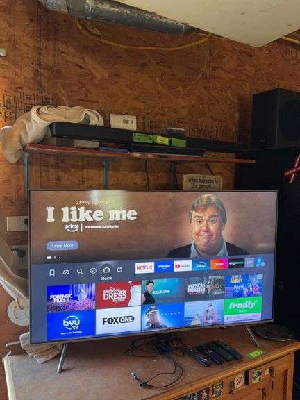 Samsung 55 inch flat screen TV model QN55QFNAF, Samsung sound bar and blu-ray player image