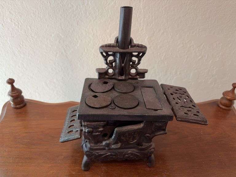 Unmarked cast iron mini cookstove 8" wide x 8.5" tall image