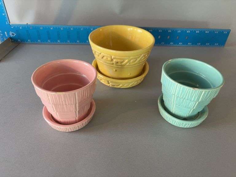 Three McCoy planters, blue one has chipping image