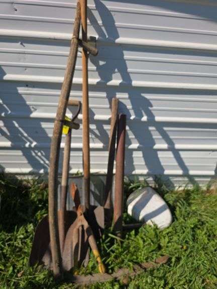 Various long handled yard tools