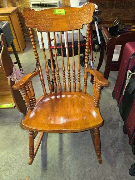 Antique pressed back arm rocker with spindle back, has pads but they hide the beauty of the wood and design of chair image