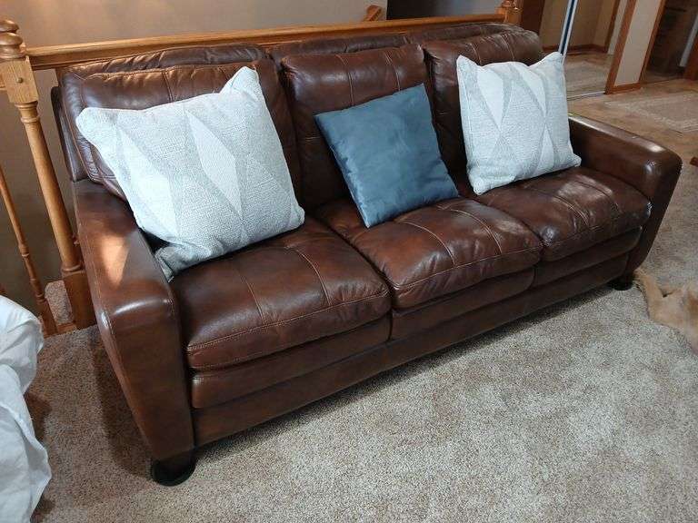 Three cushion sofa with throw pillows 80” long image