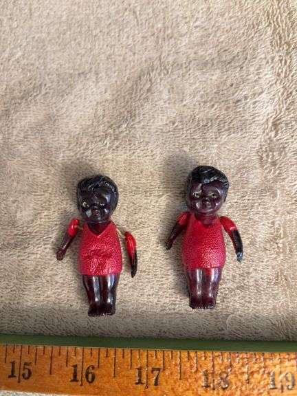Two black celluloid dolls w jointed arms image