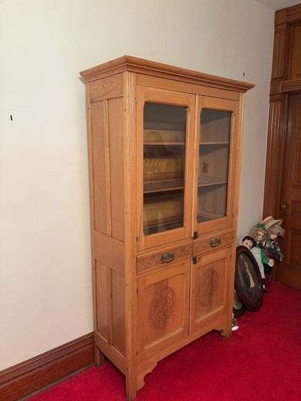 Oak kitchen cupboard with upper glass front doors, two drawers and lower doors Very intricate details on front 18D x 43L x 76H image