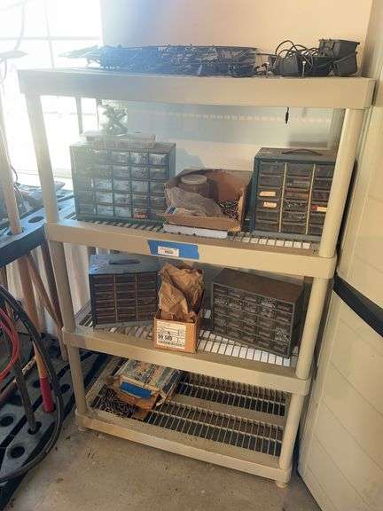 Plastic shelving unit and four hardware assortment bins, and boxes of screws