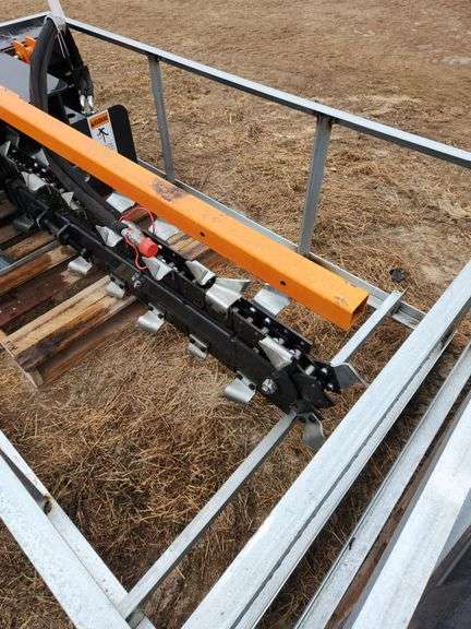 Trencher	WOLVERINE	TCR-12-48H	 Skid Steer Trencher Attachment  Trenching Depth: 48 in Trenching Width: 8 in Flow Rec:20-30 gpm Clearing Auger Diameter:15 in", MOUNT VERNON image