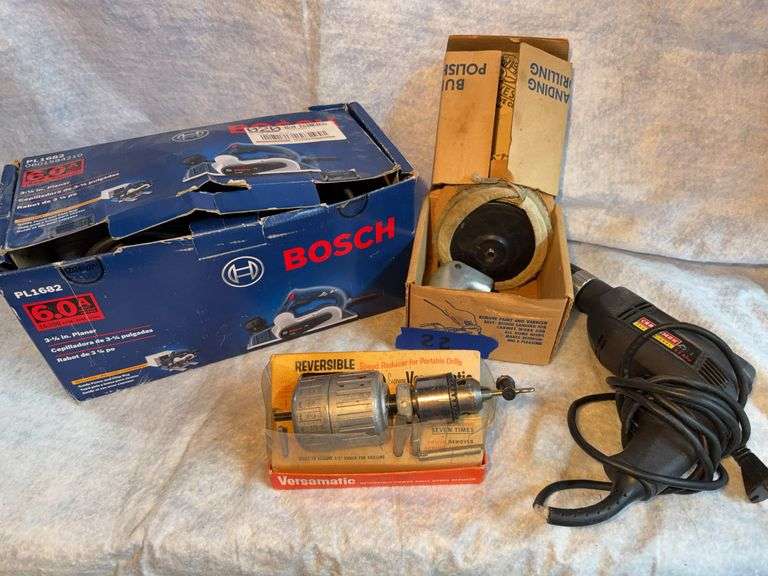 Bosch 3 and 1/4-in planer appears unused. Craftsman 3/8 drill, variable speed with reverse, Craftsman angle driver accessory for drill. Versamatic speed reducer for drill. image