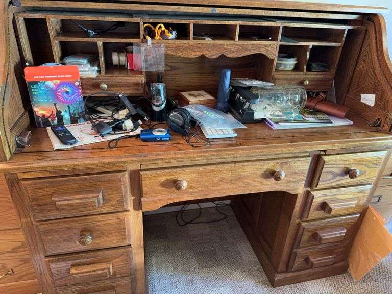 Contents in top of desk and drawers includes Canon digital camera, Roku hookup, LED strip lights, office supplies, etc image