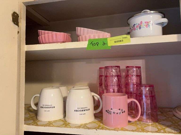 Starbucks coffee cups, pink plastic juice glasses, pink heart shaped soufflés and a little tiny pan image