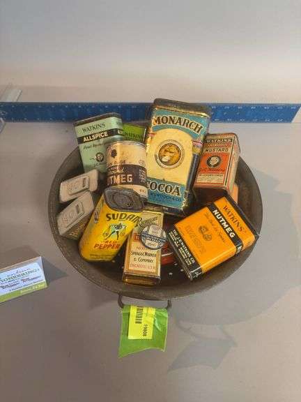 Strainer w many vintage spice tins image