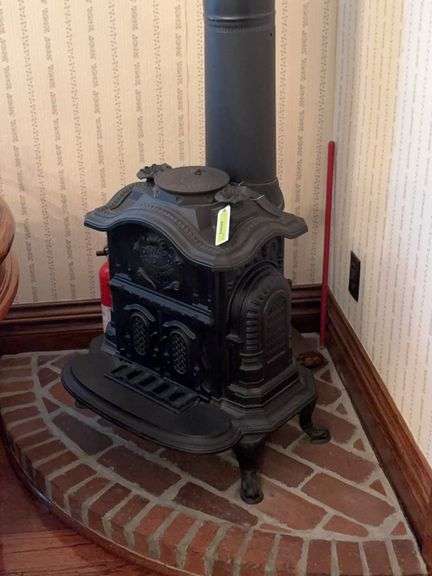 Onward #3 wood room stove, 23" wide x 25" tall , comes with brick half round "hearth" and chimney pipe image