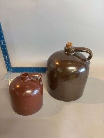 Minnesota Stoneware Co beehive style jug 1/2 gallon and an unmarked larger maybe a 1??? image