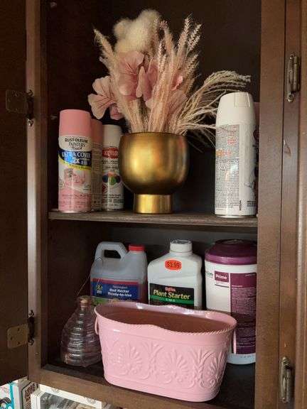 Spray paints, plant starter, hummingbird nectar, bee catcher, pink metal tin w scissors and tape measures image