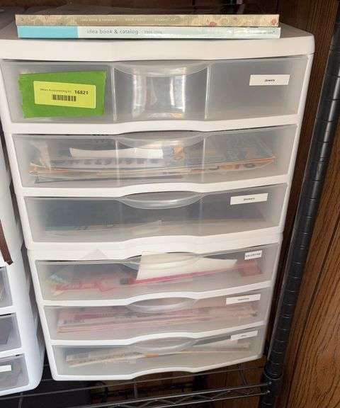 Scrapbooking paper and (2) 3 drawer plastic cabinets image
