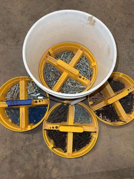 Roofing lot with four shingle shovers shovels, bucket of screws, four trays in 5 gallon bucket, two partial boxes of wire collated roofing nails, 1-1/4 in by .120 in diameter electro galvanized. image