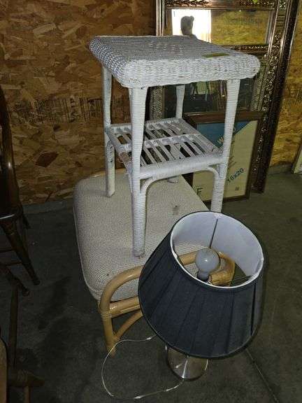 Bamboo ottoman, wicker table and chrome lamp image
