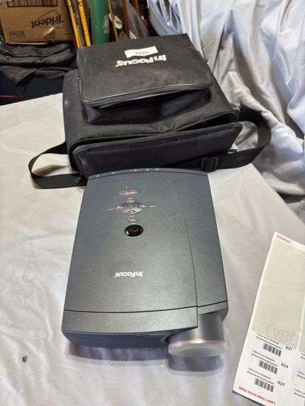 In focus projector with carrying case and cords/acessories