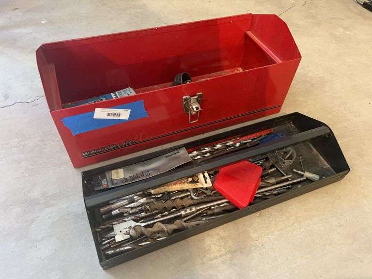 Red metal toolbox with drillbits