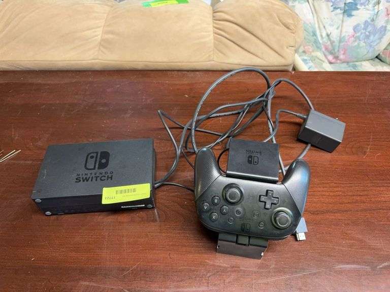Nintendo Switch pro controller with charging dock and console dock image
