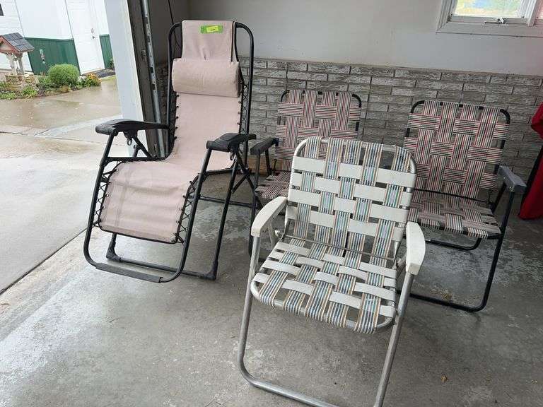 Zero gravity chair and 3 straight lawn chairs image