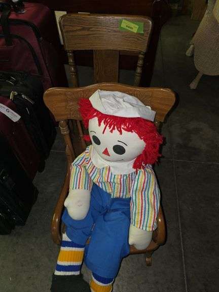 2 children's arm rockers and a large Raggedy Andy image