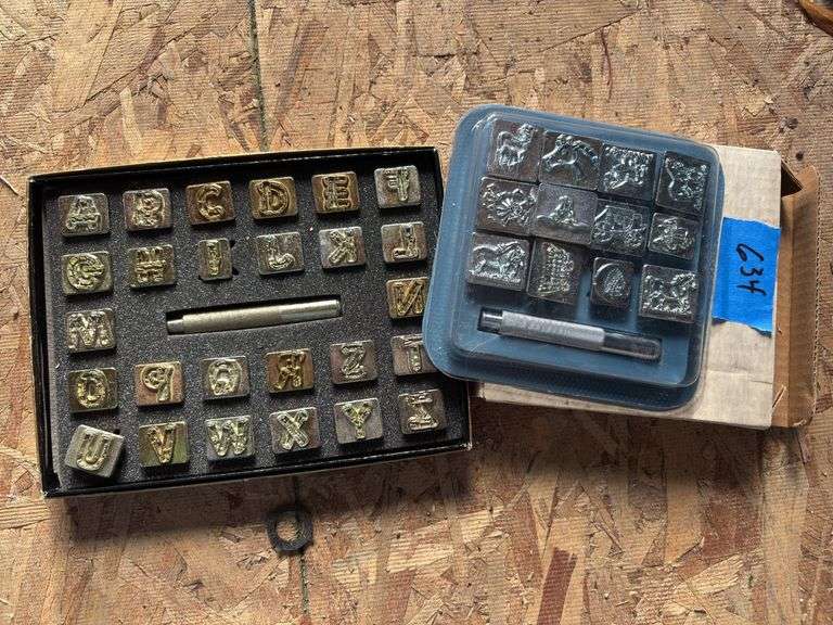 Two sets of leather stamps